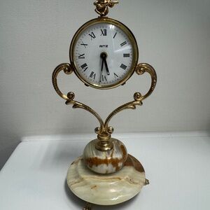 Vintage “Ritz” cherub mantel/desk clock with a brass-tone frame and an onyx